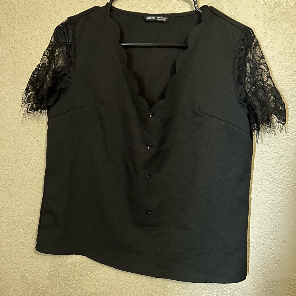 Black lace sleeved top with scalloped neck line